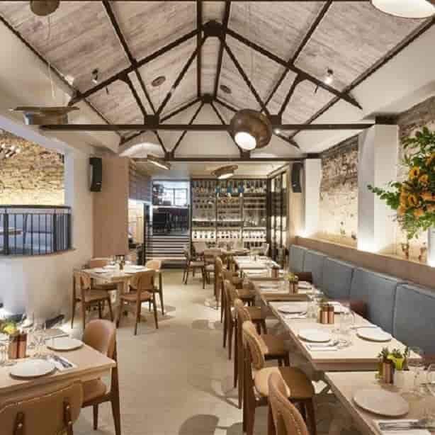Stylish Lower Restaurant in Meraki London, ideal for intimate meetings and networking events.