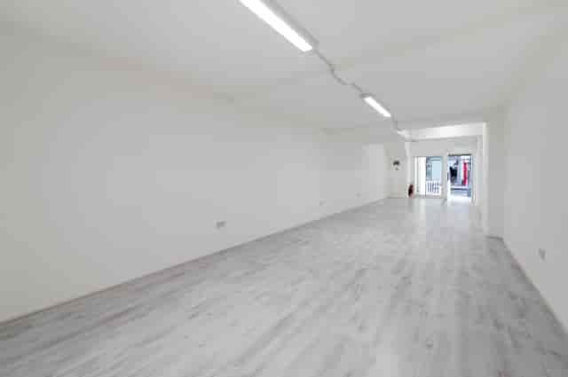 Spacious blank canvas venue with natural light for workshops and corporate events.