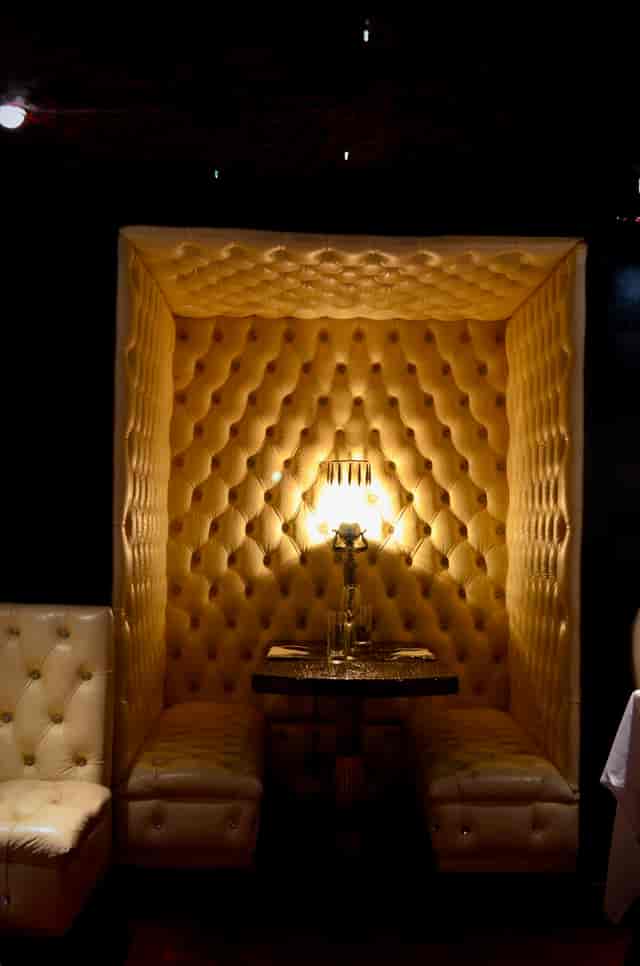 Luxurious White Room with tufted walls for intimate events and private meetings.