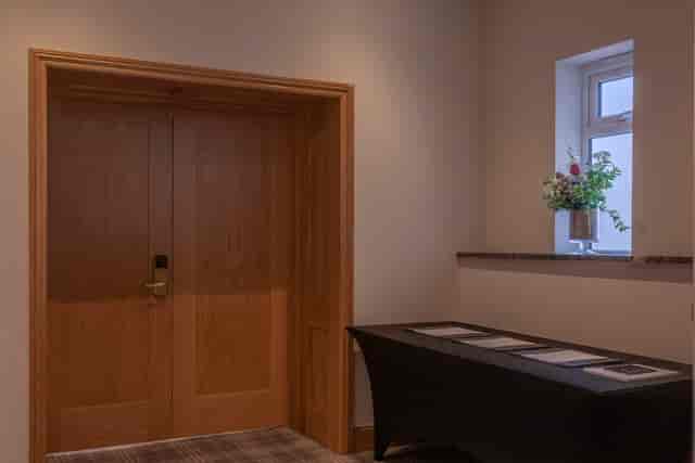 Cromwell Room entrance at Oatlands Park Hotel, elegant doors for events and gatherings.