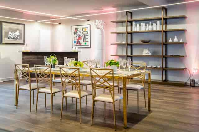 Elegant meeting space with long dining table, ideal for networking events.