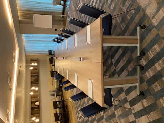 Hyatt Regency Manchester Club Lounge meeting room with a long table, ideal for workshops.