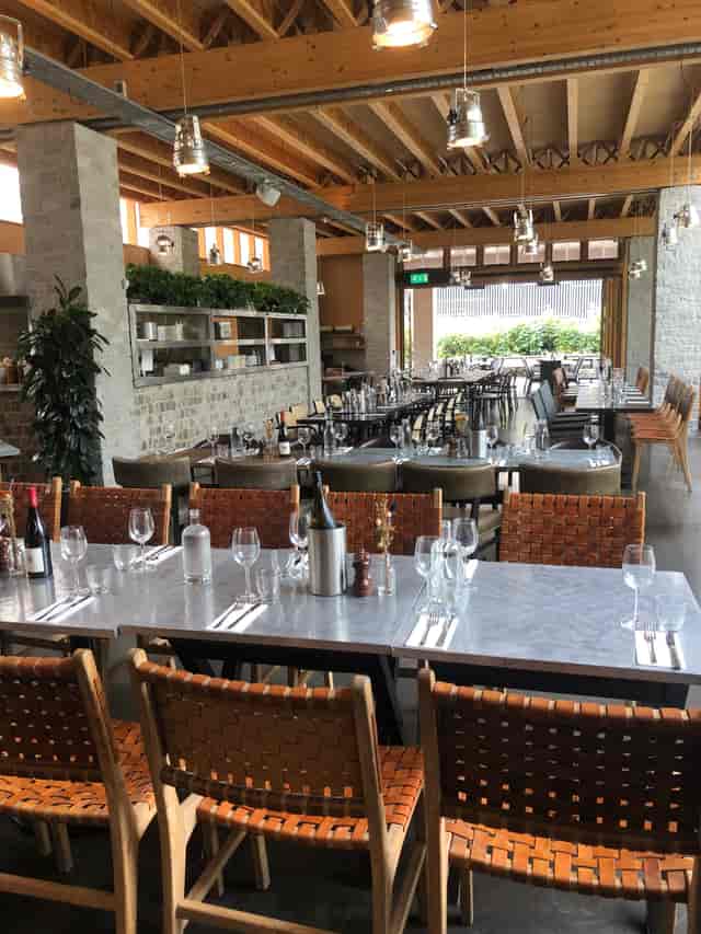 Elegant restaurant interior with modern decor, ideal for corporate events and gatherings.
