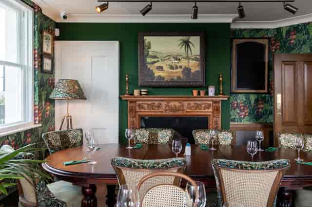 Elegant meeting space with wooden table, ideal for executive meetings and gatherings.
