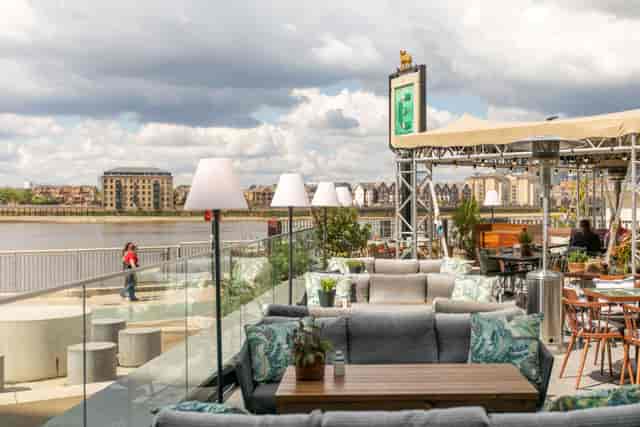 Stylish Roof Terrace at Enderby House with scenic water view for social events.
