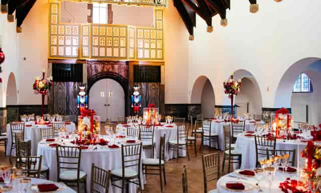 Elegant banquet hall at Daisy Bank Manor with red accents, perfect for weddings and events.