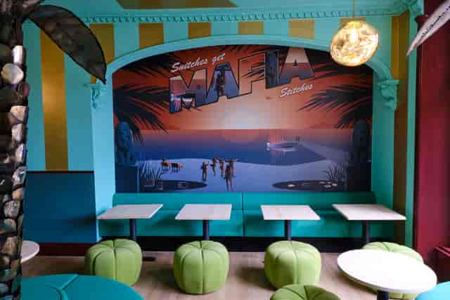 Vibrant Miami Bay meeting space with bold mural for creative events and gatherings.