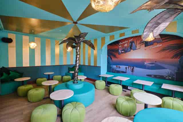 Vibrant Miami Bay event space with tropical decor for casual gatherings and meetings.