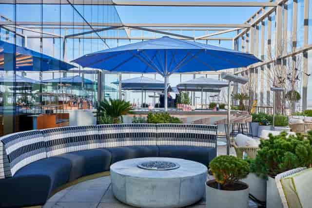 Half Terrace Hire at 20 Stories Restaurant, modern rooftop venue for events with blue umbrellas.