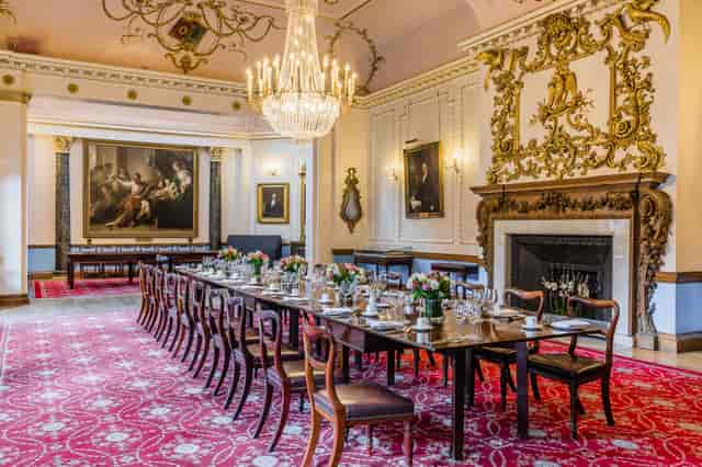 Elegant dining room with fine china, perfect for formal events and meetings.