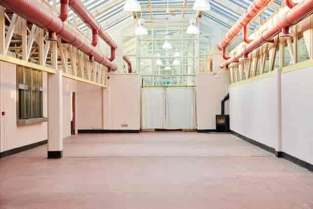 Hackney Depot Main Hall: spacious venue with high ceilings for events and gatherings.