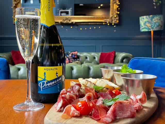 Elegant Imperial Arms Lounge setup with Prosecco for networking events and gatherings.
