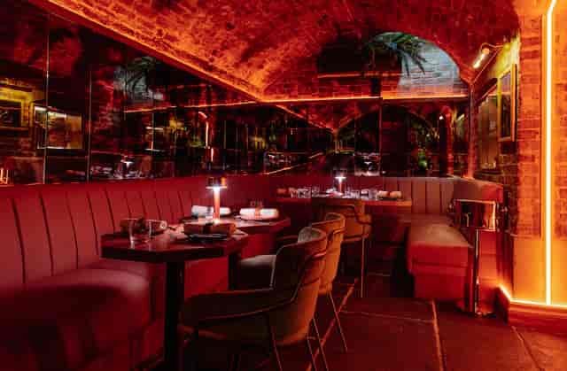 Stylish Cache Cache venue with cozy seating for intimate events and gatherings.