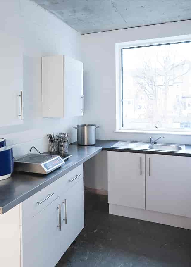 Modern kitchen in Mend Hackney, featuring stainless steel surfaces for events and catering.