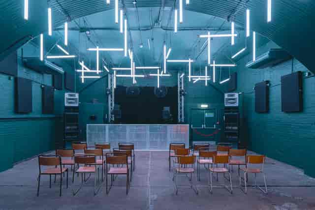 Industrial venue, brick stage, product launch, concert