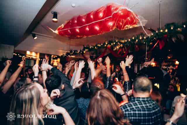 Vibrant event atmosphere at Revolution Oxford Road, Manchester for social gatherings and parties.