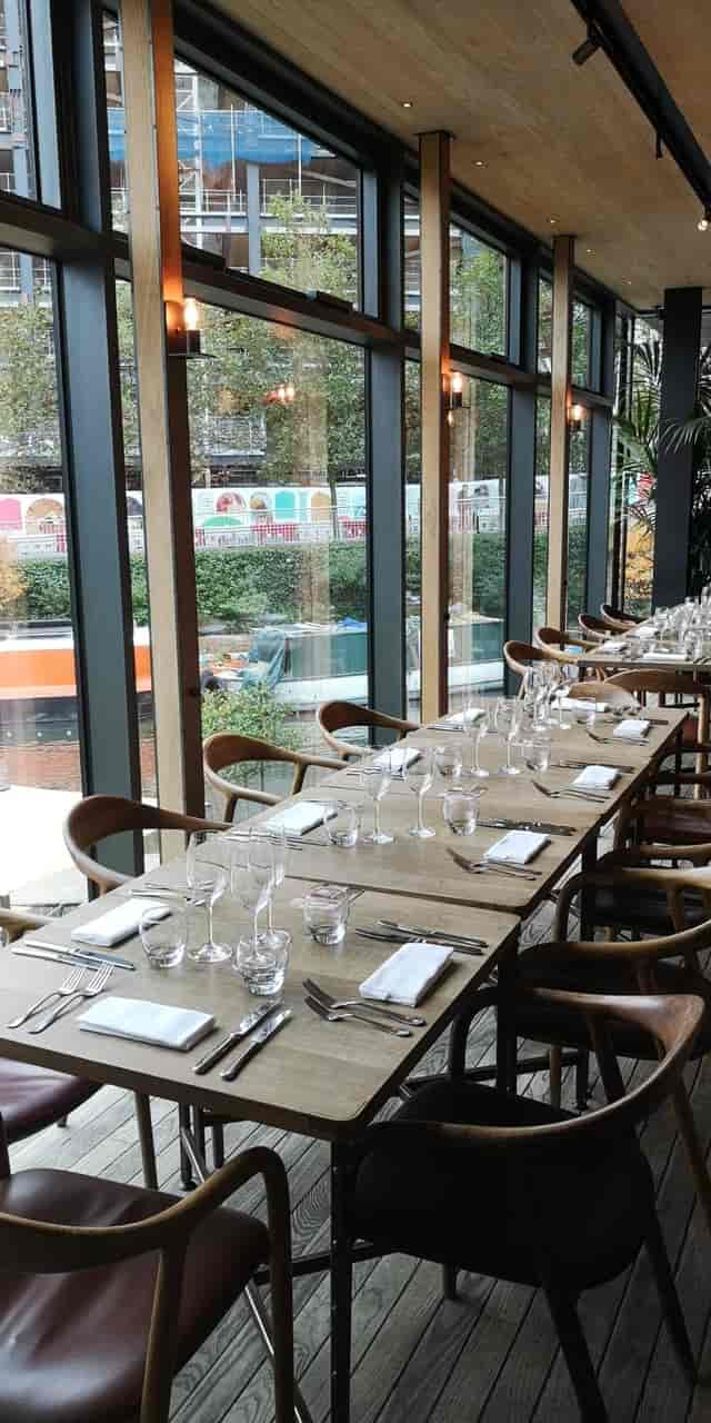 Elegant long dining table set for corporate events in The Lighterman.