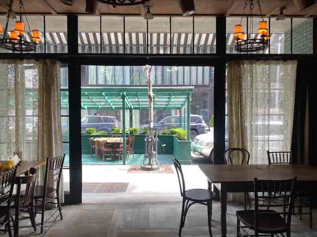 Gemma Wine Room at The Bowery Hotel, rustic tables, ideal for events and meetings.