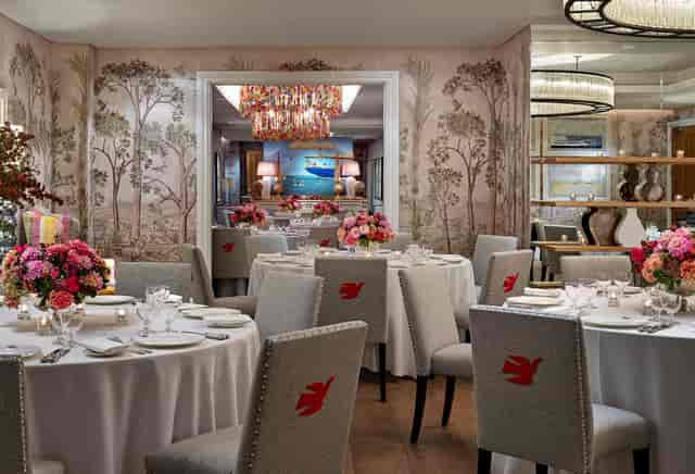 Elegant dining space with floral wallpaper for upscale events at The Crosby Street Hotel.