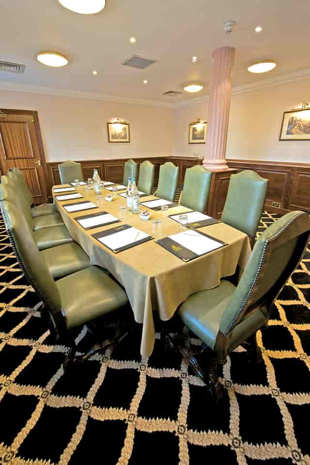 Boardroom at Britannia Hotel Manchester, elegant setup for professional meetings.