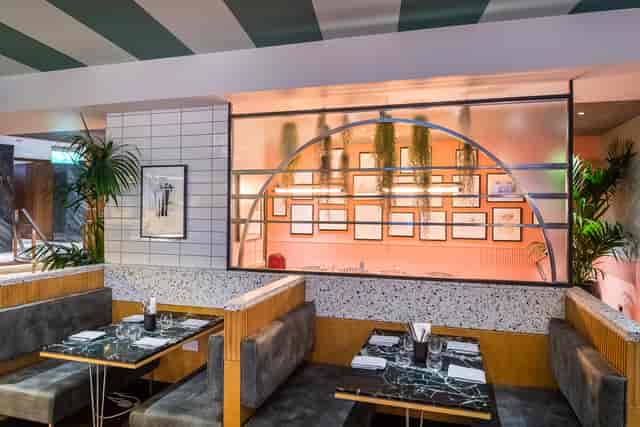 Shakedown Restaurant dining area with cozy booths, ideal for corporate events and gatherings.