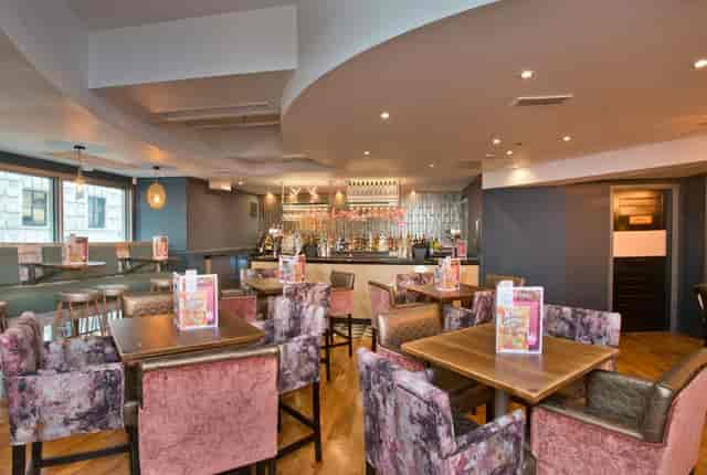 Stylish Mezzanine at Slug & Lettuce, ideal for meetings and networking events.