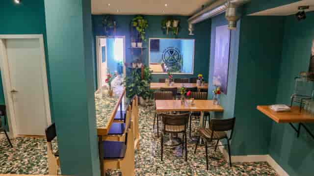 Vibrant event space with greenery, ideal for workshops and team meetings in Liverpool.