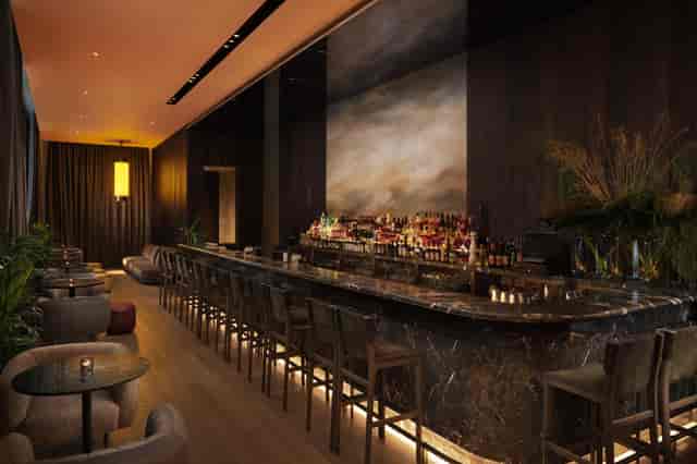 Ginger Lily bar with marble counter, ideal for networking events and cocktail receptions.