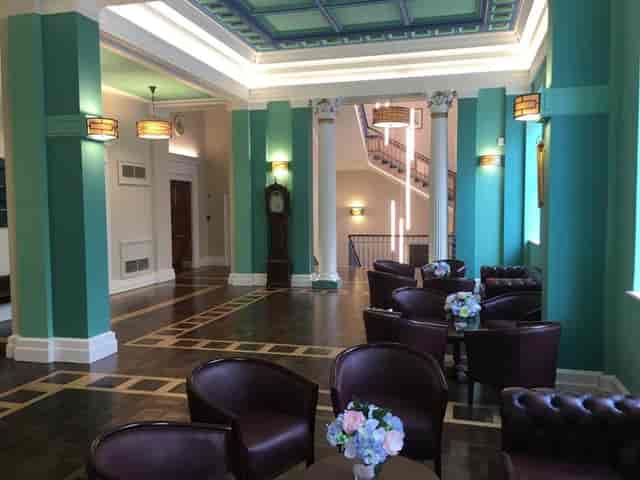 Elegant dining room with high ceilings, perfect for networking events and receptions.