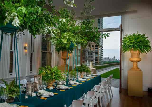 Elegant long table in May Room, Carnegie Hall, perfect for upscale events with greenery.