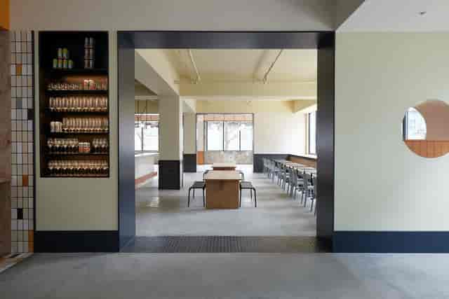 Modern event space at Talea Beer Co. with natural light, ideal for meetings and gatherings.