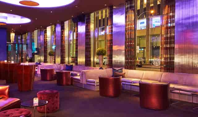 Semi-private VIP room at 48 Lounge with plush seating, ideal for cocktail receptions.