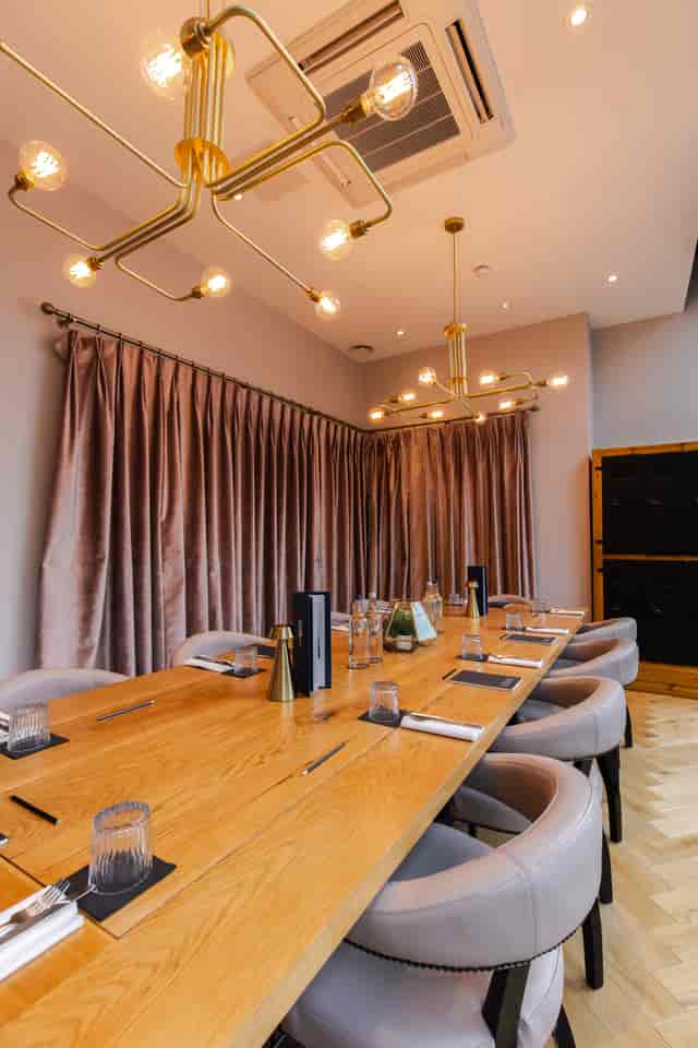 Private dining room at Embankment Kitchen, ideal for corporate meetings and intimate gatherings.