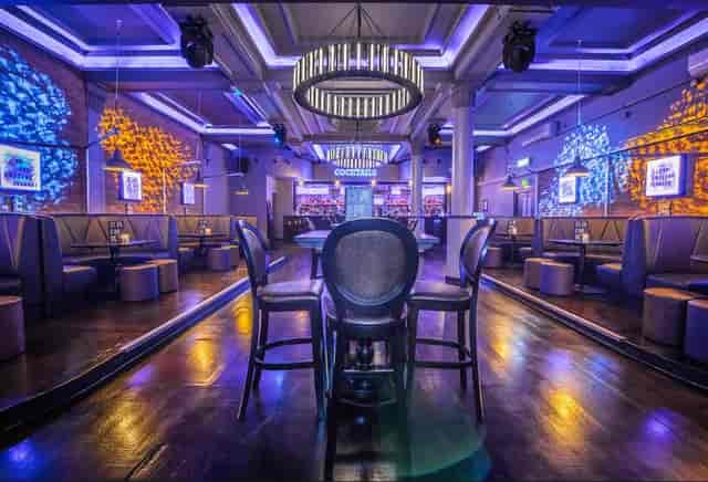 Modern event space in Sway with vibrant lighting, ideal for gatherings and networking.