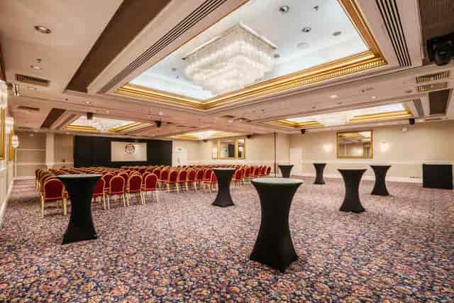 Cromwell Suite event space with elegant chandeliers for networking and receptions.