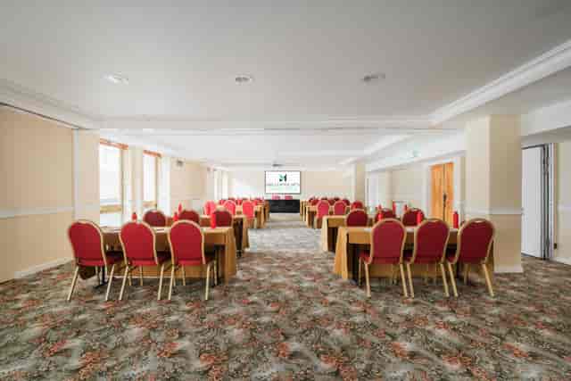 Kensington Suite meeting space with red chairs, ideal for corporate events and workshops.