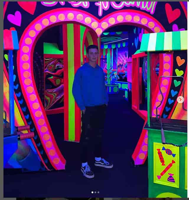Vibrant neon-lit event space with heart-shaped entrance for themed parties and immersive experiences.