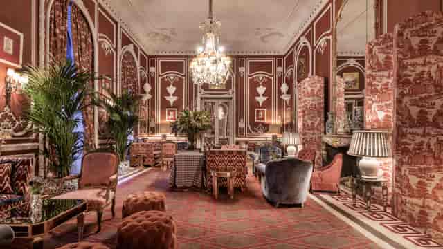 Elegant Salon Rojo in Hotel Santo Mauro, Madrid, perfect for networking events and gatherings.