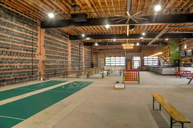 The Crow's Nest at Hook Hall: industrial event space with exposed brick for gatherings.