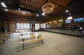 Rustic tea house venue with wooden benches for casual gatherings and events.