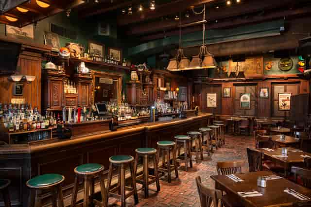 Cozy wood-toned bar at The Dubliner, perfect for networking events and casual gatherings.