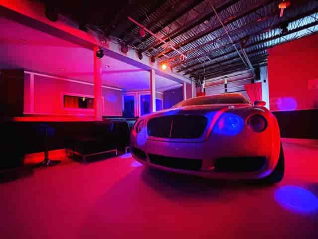 Luxury car in vibrant event space at Studio Stage, perfect for high-end parties and gatherings.