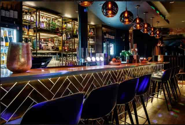 Stylish bar at Velvet Brasserie, ideal for networking events and cocktail receptions.