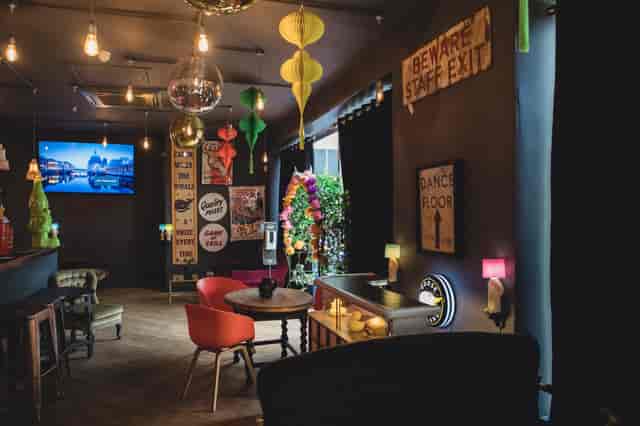 Vibrant Sobremesa Bar event space with colorful decor for networking and celebrations.