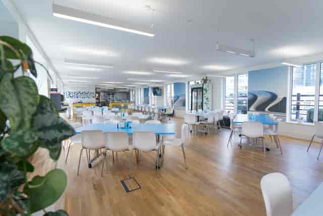 Rooftop Kitchen event space with natural light, ideal for meetings and gatherings.