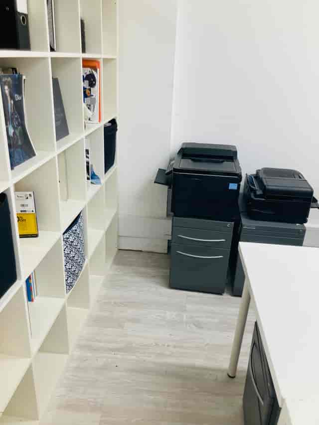 Functional workspace in The Fashion Building Basement with organized shelving for event planning.