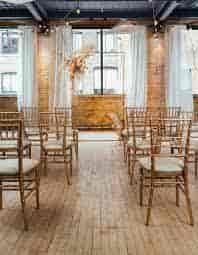 Elegant event space with wooden chairs, perfect for gatherings in Toronto.