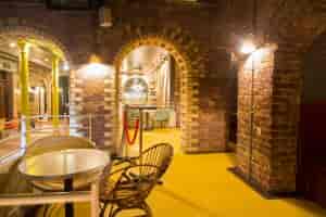 Vibrant event space with exposed brick arches for creative gatherings in London.