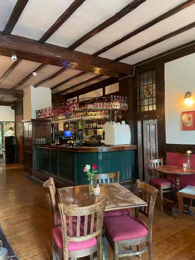 Red Room bar at The Old Red Lion, rustic ambiance for networking events and gatherings.