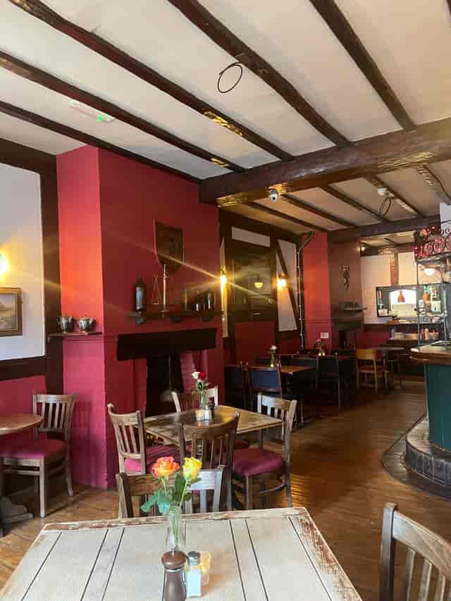Cozy Red Room at The Old Red Lion, perfect for intimate gatherings and meetings.